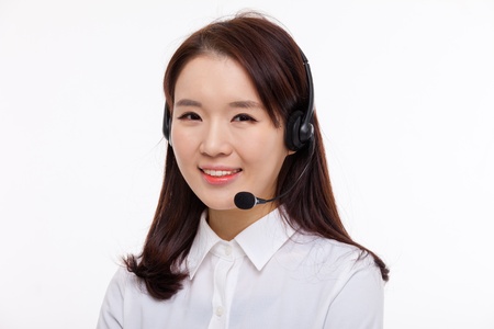 Smiling call center operator business woman isolated on white background  の写真素材