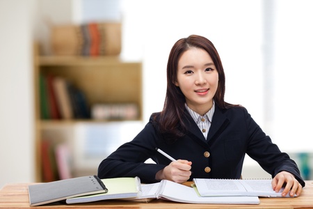 Young pretty Asian student indoors shot.の写真素材