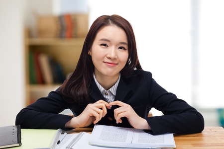 Young pretty Asian student indoors shot.の写真素材