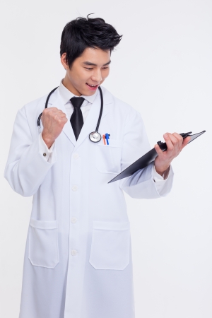 Young Asian showing fist doctor isolated on white background の写真素材
