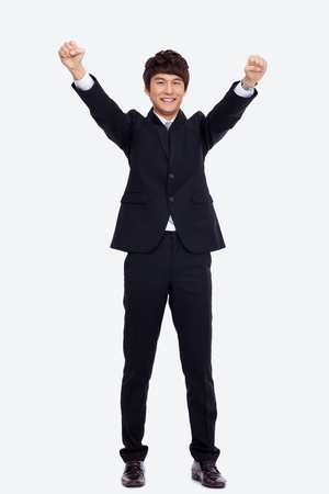 Showing fist young Asian business man isolated on white background. の写真素材