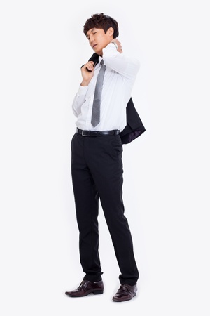 A tired Asian business man isolated on white background.の写真素材