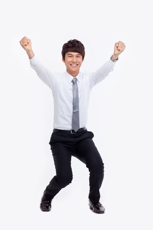 Showing fist young Asian business man isolated on white background. の写真素材