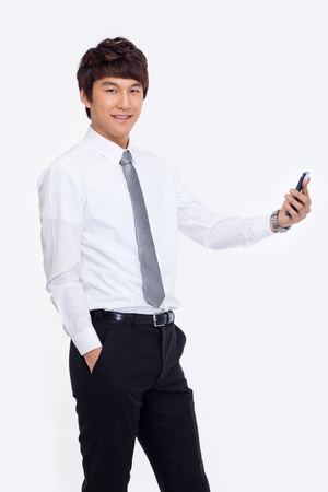 Asian business man with cellphone isolated on white background.の写真素材