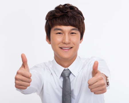 showing thumb Asian young business man close up shot  isolated on white background.の写真素材