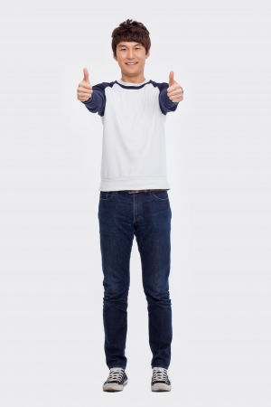 Showing thumb Asian young  man  isolated on white background.の写真素材