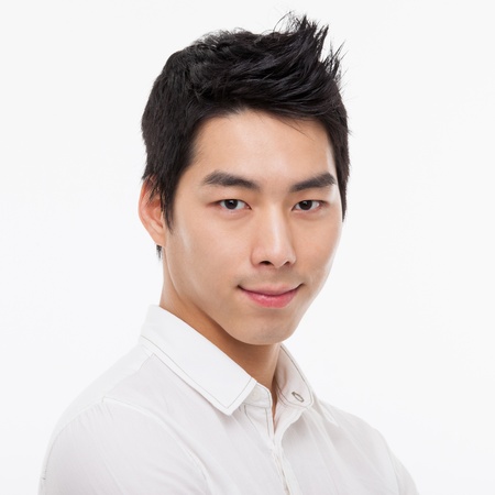 Young Asian man close up shot isolated on white の写真素材