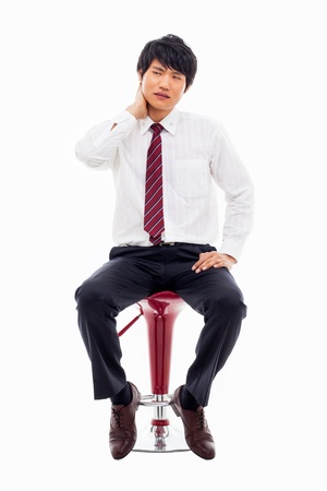 Young Asian man having a stress on isolated on white background. の写真素材