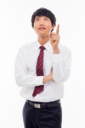 Young asian man indicated up side isolated on white background. の写真素材