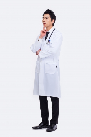 thinking Young Asian doctor isolated on white background. の写真素材