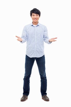 Young Asian man showing welcome sign isolated on white background. の写真素材