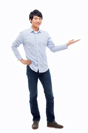 Asian man present something isolated on white background.の写真素材