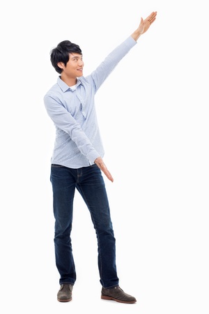 Asian man present something isolated on white background.の写真素材
