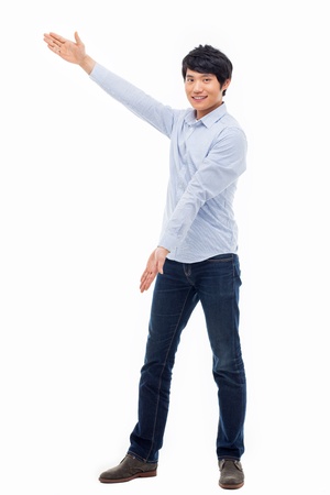 Asian man present something isolated on white background.の写真素材