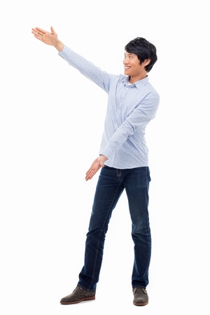 Asian man present something isolated on white background.の写真素材