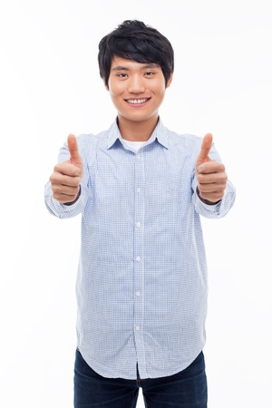 Young Asian man showing thumb isolated on white background. の写真素材
