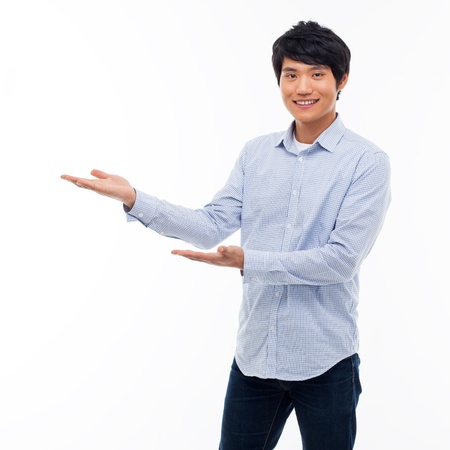 Asian man present something isolated on white background.の写真素材