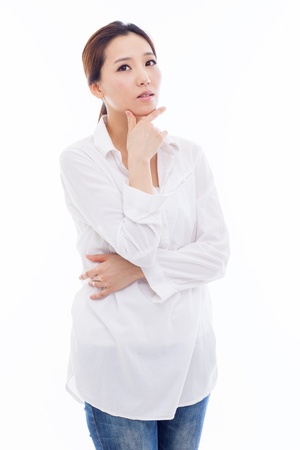 Thinking young Asian woman isolated on white backgroundの写真素材