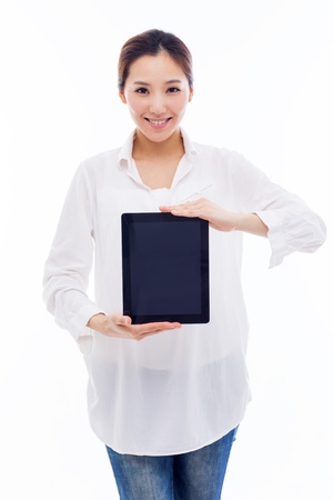 Woman holding tablet computer isolated on white background.の写真素材