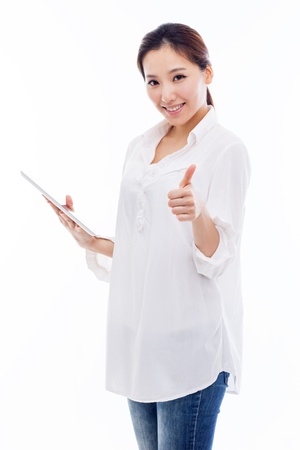 Woman holding tablet computer isolated on white background.の写真素材