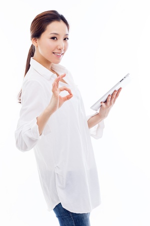 Woman holding tablet computer isolated on white background.の写真素材