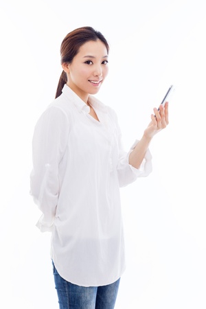 Young Asian woman using a smart phone isolated on white background. の写真素材