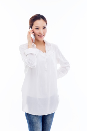 Young Asian woman using a smart phone isolated on white background. の写真素材