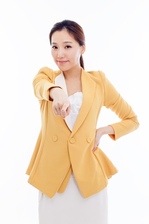 Young business woman pointing you isolated on white background.の写真素材