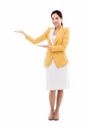 Asian business woman indicate blank space isolated on white background. の写真素材