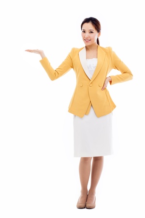 Asian business woman indicate blank space isolated on white background. の写真素材