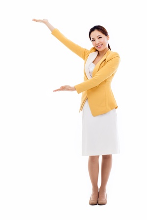 Asian business woman indicate blank space isolated on white background. の写真素材