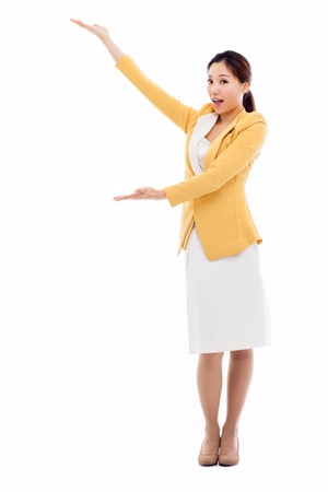 Asian business woman indicate blank space isolated on white background. の写真素材