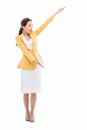 Asian business woman indicate blank space isolated on white background. の写真素材