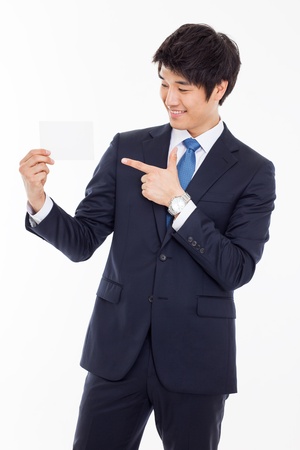 Asian young business man with blank card isolated on white background の写真素材