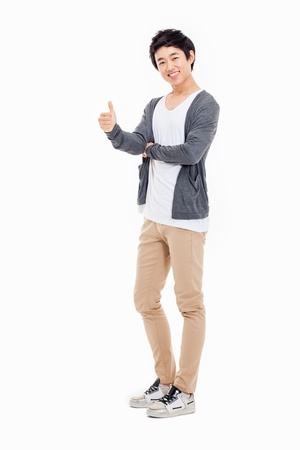 Showing thumb Asian young  man  isolated on white background.の写真素材