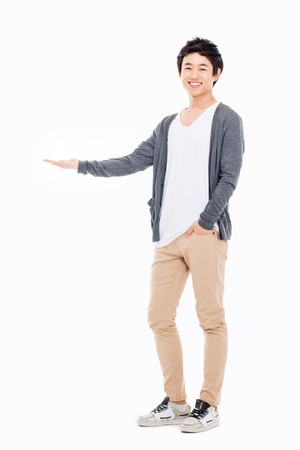 Asian man present something isolated on white background.の写真素材
