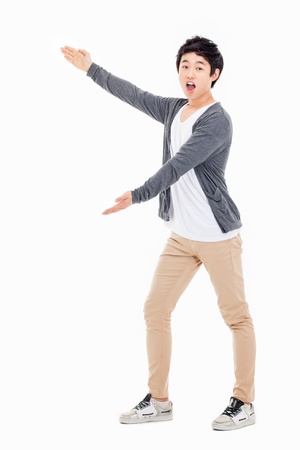 Asian man present something isolated on white background.の写真素材