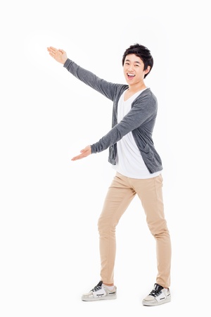 Asian man present something isolated on white background.の写真素材