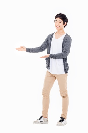 Asian man present something isolated on white background.の写真素材