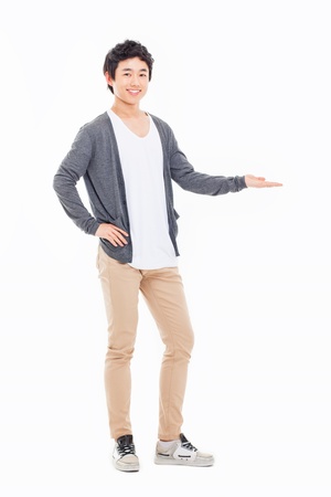 Asian man present something isolated on white background.の写真素材