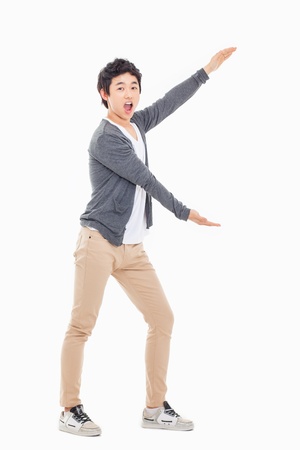 Asian man present something isolated on white background.の写真素材