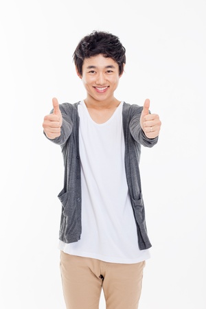 Young Asian man showing thumb isolated on white background. の写真素材