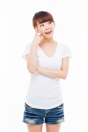 Thinking young Asian woman isolated on white backgroundの写真素材
