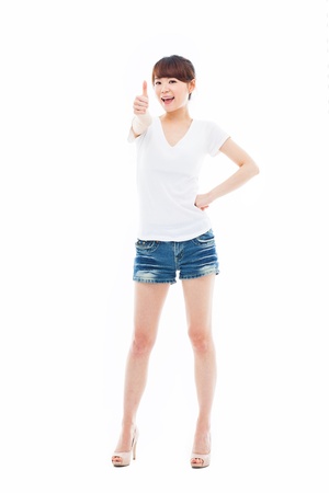 Young Asian woman showing thumb isolated on white background.の写真素材
