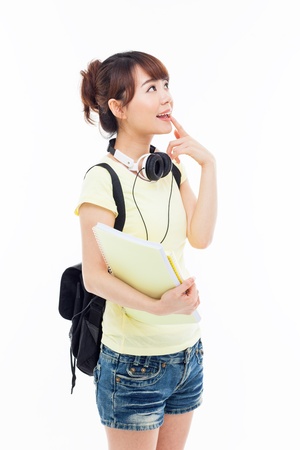 Thinking young Asian student girl isolated on whiteの写真素材