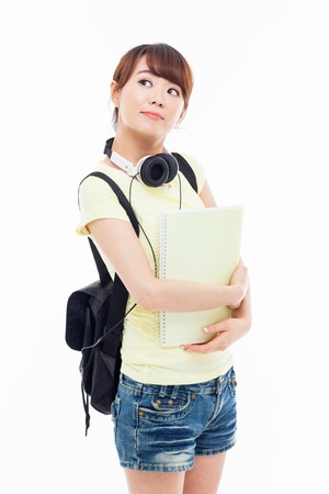 Thinking young Asian student girl isolated on whiteの写真素材