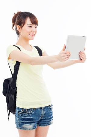 Woman holding tablet computer isolated on white background の写真素材