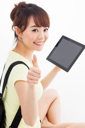 Woman holding tablet computer isolated on white background.の写真素材