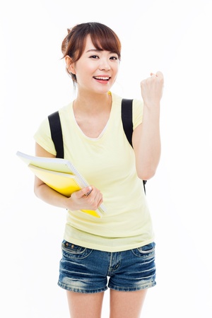 Young Asian student woman show fist isolated on white.の写真素材