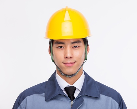 Young Asian engneer close up shot isolated on white background. の写真素材